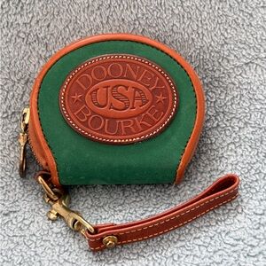 Dooney and Bourke coin purse in jade green nubuck leather with tan trim
